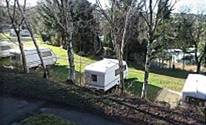 Touring caravans pitched on terraced levels