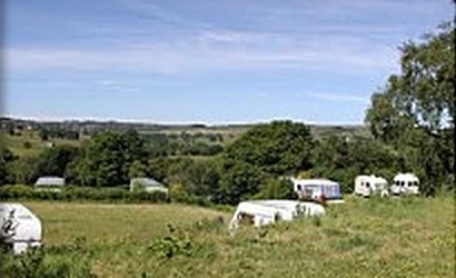View across the valley with caravans at Manor House Farm